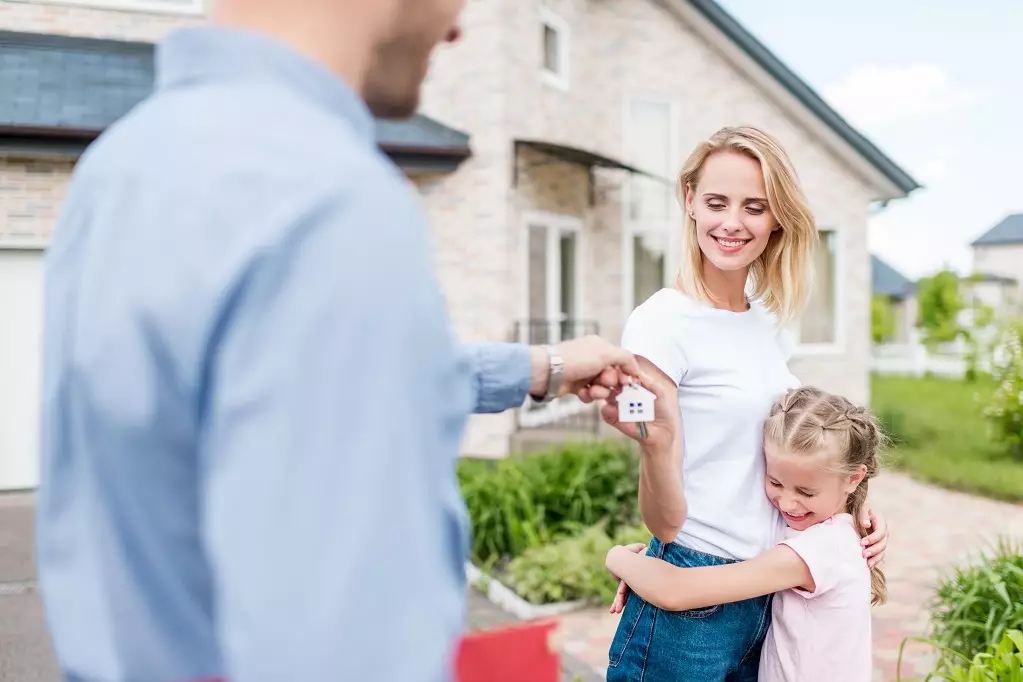 Happy family gets their new house key