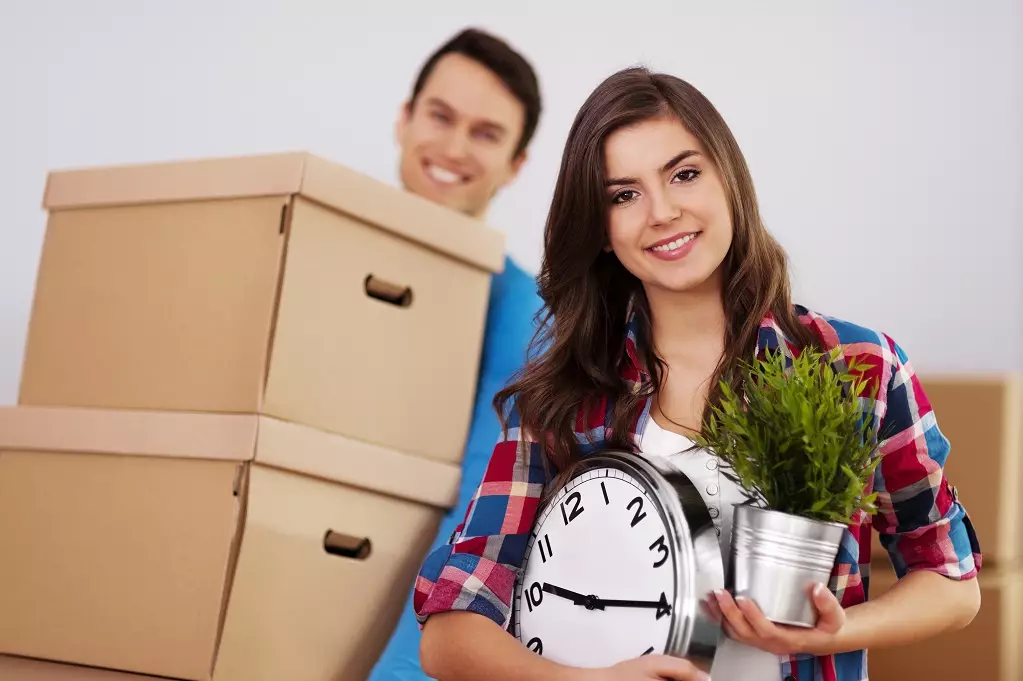 Young couple moving in their new house